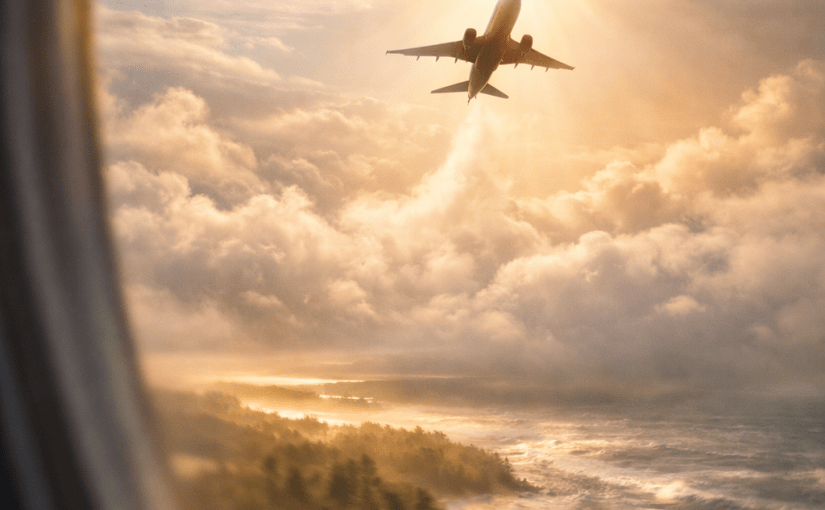 Airplane rising above clouds and coastline, capturing motion, travel, and expanded perception of nature.